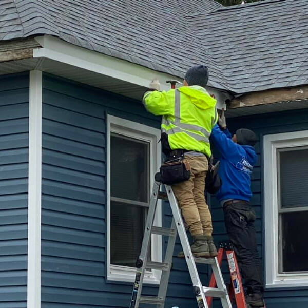 New Fascia board being installed on home